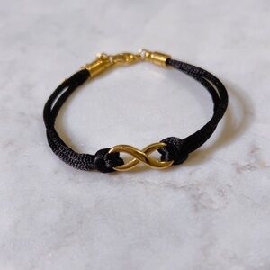 CELINE13 Infinity Charm Bracelet – Black Cord &‎ Polished Titanium Steel